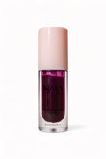Kiara Beauty lip oil with pink cap on a white background
