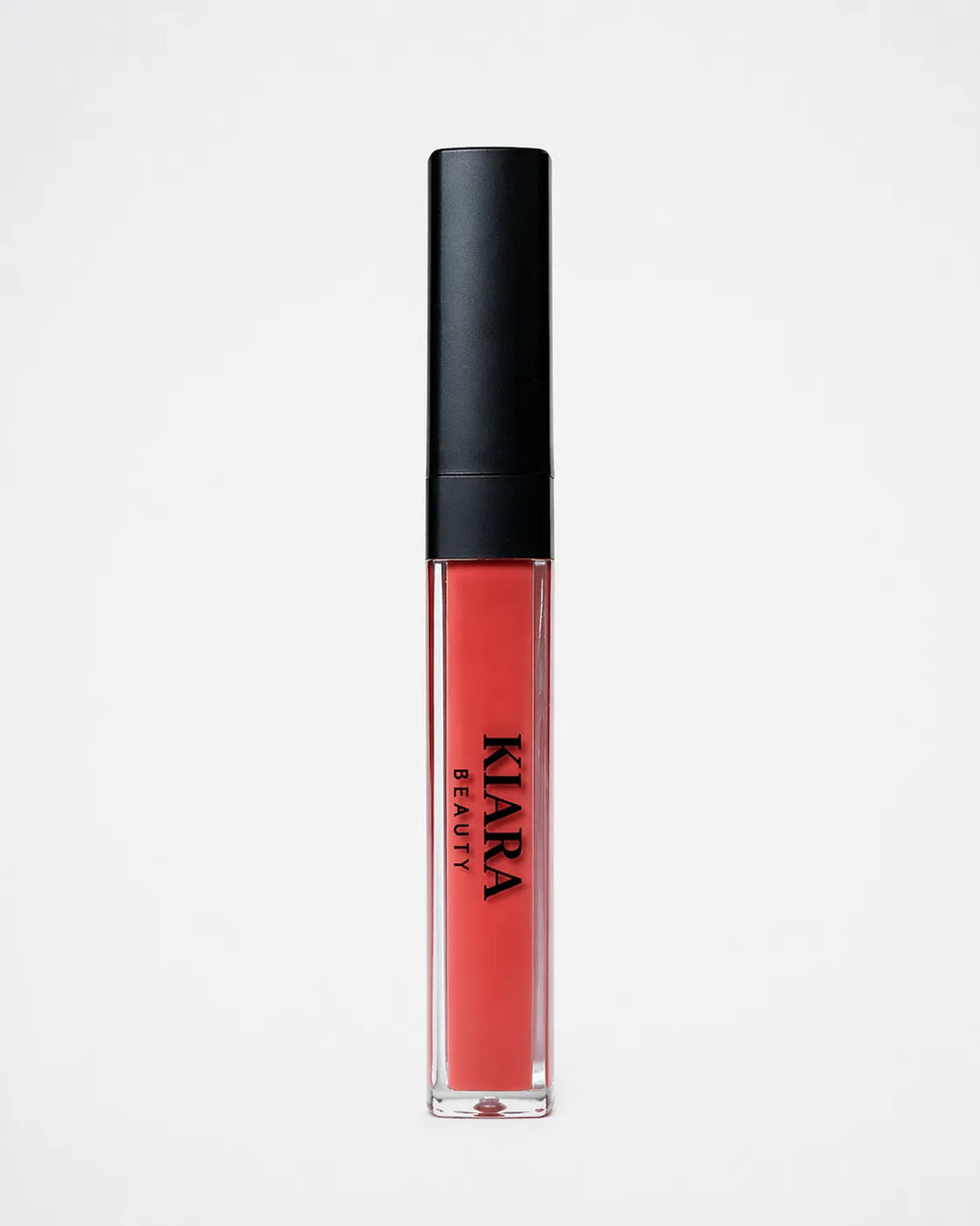 Lip gloss with black cap and visible brand name on a light gray background
